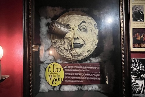 Shadow box display of a piece of art called 'A Trip to the Moon'